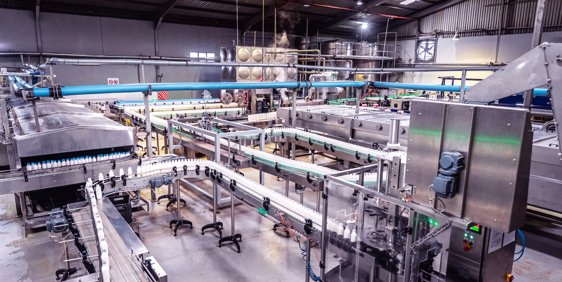 Conveyor belt with bottles at a modern beverage plant